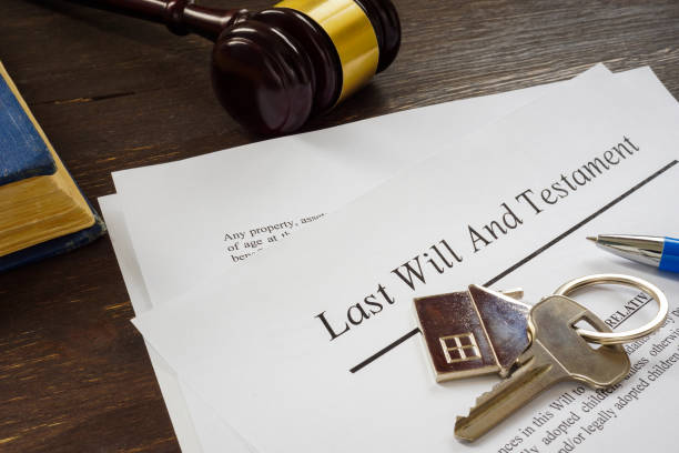 Last will and testament papers and key as symbol of property.